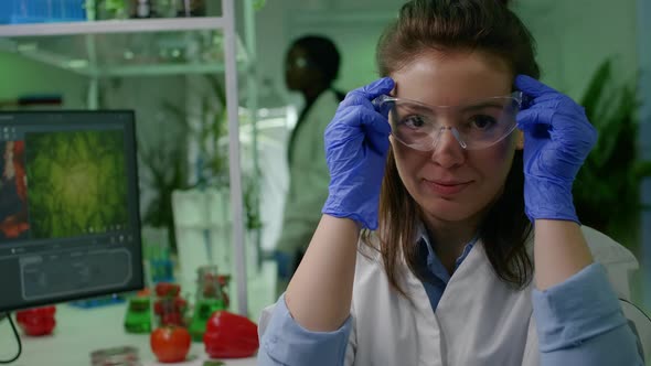 Portrait of Chemist Researcher in Medical Equipment Looking Into Camera alt