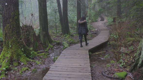 Girl Walking in the Canadian Rain Forest alt