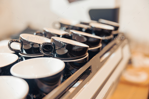 Collection of black coffee cups in cafeteria or coffee shop Stock Photo by  KostiantynVoitenko