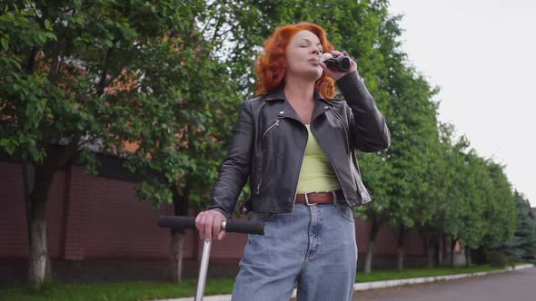 Medium Shot Happy Confident Attractive Retro Woman Drinking Soda Water in Slow Motion Looking at alt
