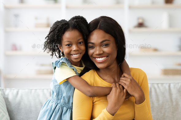 Young Beautiful Black Woman And Her Cute Preteen Daughter Posing At ...