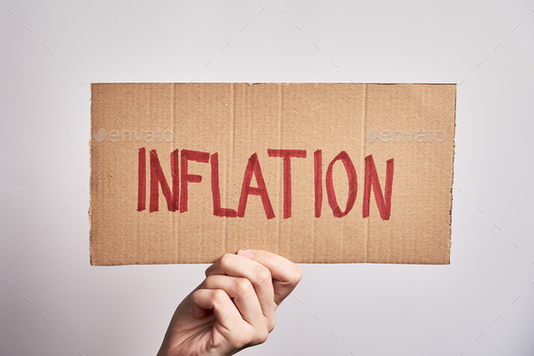 World inflation concept. Woman hold sheet with word inflation - Stock Photo - Images