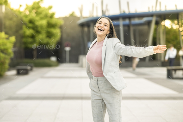 business woman, raise your hands free when leaving work