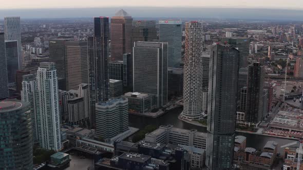 Aerial Slide and Pan Footage of Modern Business Urban District Canary Wharf with Group of Tall alt