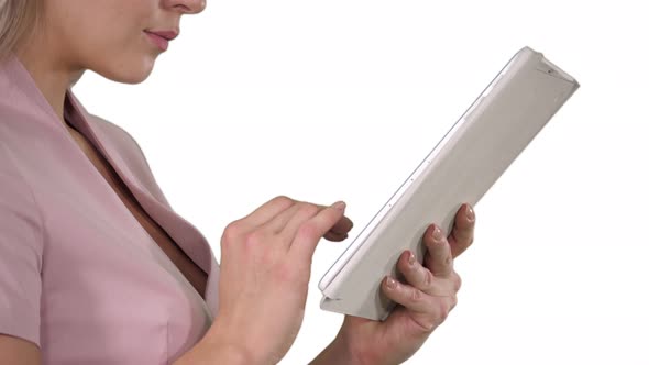 Female hands using tablet on white background. alt