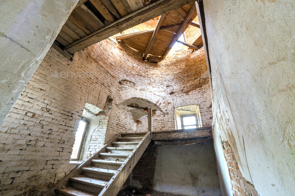 Large spacious forsaken empty basement room of ancient building or palace with cracked plastered - Stock Photo - Images