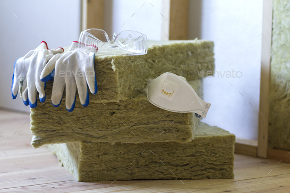 Rock wool and fiberglass insulation staff material for cold barrier. Tools for work with glass wool
