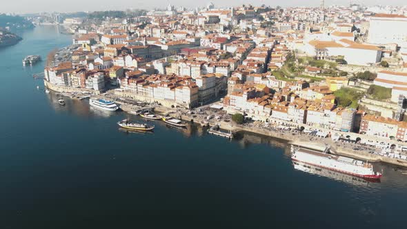 Panoramic view of Ribeira, Porto, and Douro river. Aerial manning shot alt