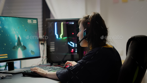 Premium Photo  Man gamer teaching his girlfriend playing space shooter  video game on rgb powerful personal computer. pro cyber woman with headset  performing video games streaming from home during online tournament