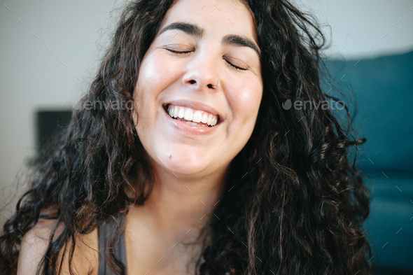 Super Close Up Of A Happy Plus Size Curly Woman Smiling To Camera Portrait During A Exercise