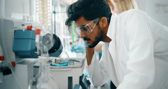 Male Student of Chemistry Working in Laboratory