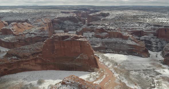 Snow covered sandstone canyons alt