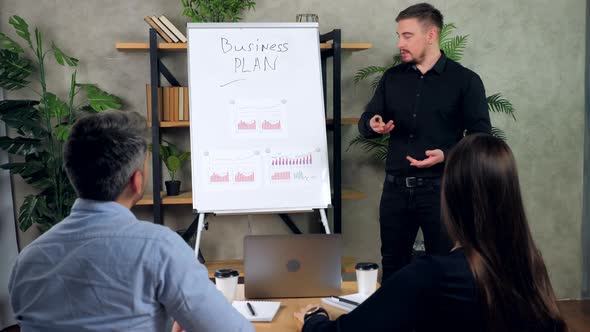 Businessman tells presentation business strategy plan achieving targets alt