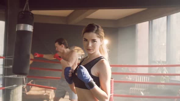 Portrait of Female Boxer in the Boxing Club alt