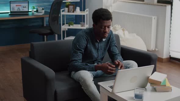 African American Entrepreneur on Remote Video Call From His Living Room alt