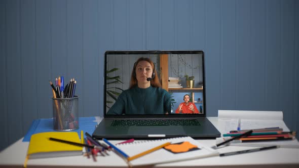 A Young Man is Talking on a Video Call with a Young Woman alt