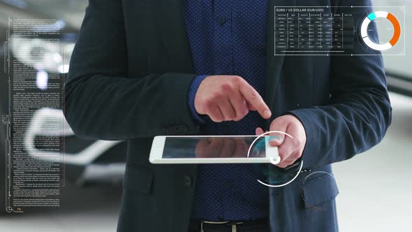 Concept of the Visual Future. A Man Holds a Tablet in His Hands and Shows Futuristic Business