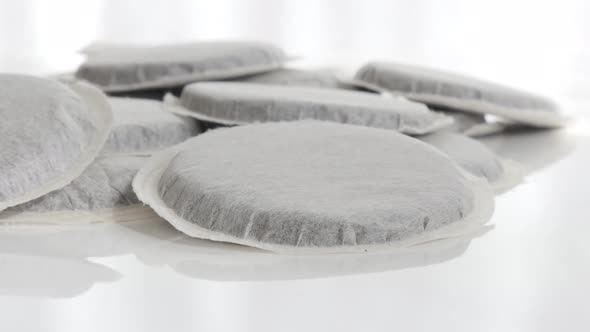 Coffee pods on pile 4K slow tilting footage alt