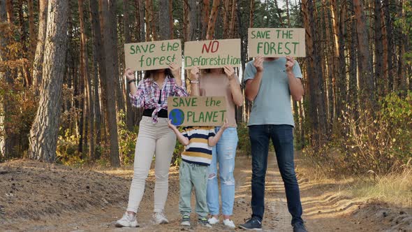 Protester Family with Posters in the Forest alt