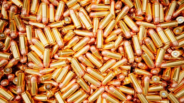 Seamless looping animation of shiny bullets. Munition depot. The ammo dump. alt