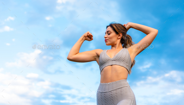 Fitness with a young blonde Caucasian woman, performing yoga and meditation exercises