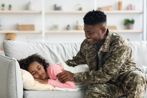 Black man soldier waking up his daughter, came back home