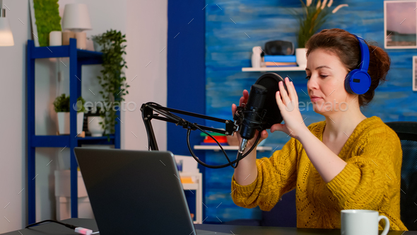 Creative influencer with headphones ready to speak during podcast