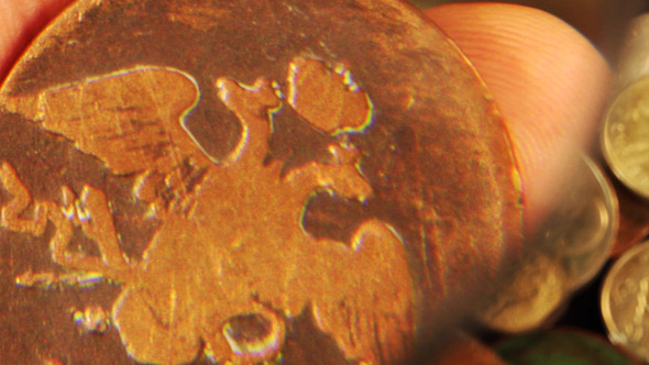 Examining An Old Coin 3