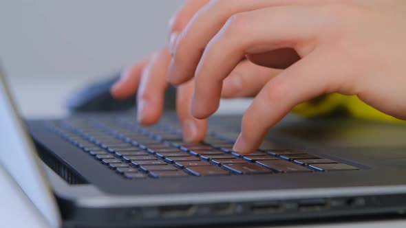 Woman working on laptop computer at home office space during lockdown in 4k footage alt