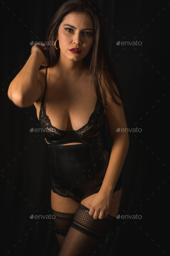 Woman with black hair wearing latex underwear Stock Photo by Unai82
