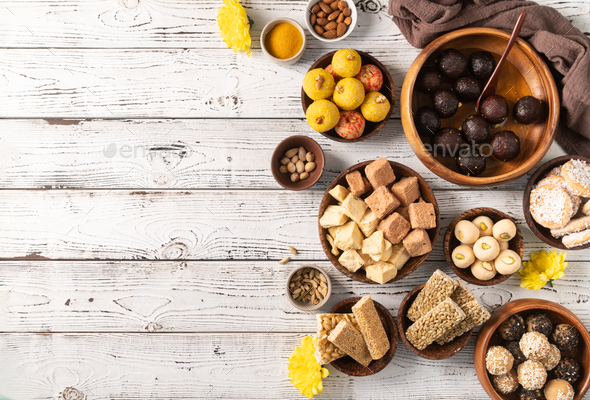 traditional indian sweets on rustic background flat lay Stock Photo by  ilonadesperada