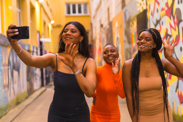 Fashionable Urban Style With Three Black African Girls On A City Street 