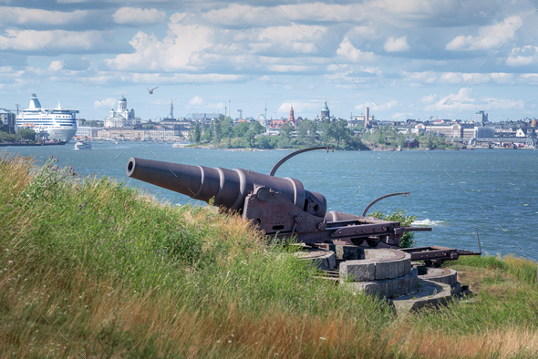 Military Artillery in Suomenlinna with Helsinki skyline on background - Helsinki, Finland