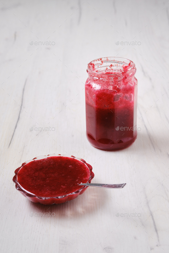 Jar and saucer with cherry jam Stock Photo by boomeart PhotoDune