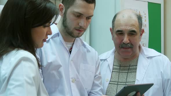 Pharmacists Using Digital Tablet While Checking Medicine in Pharmacy alt