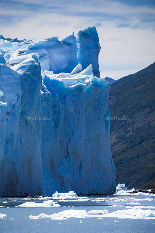 Melting glacier due to global warming and climate change causing environmental impact at Perito More