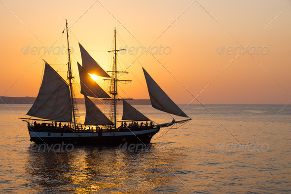 Sailing ship at sunset  - Stock Photo - Images