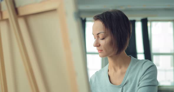 Inspired Girl Works at the Easel alt