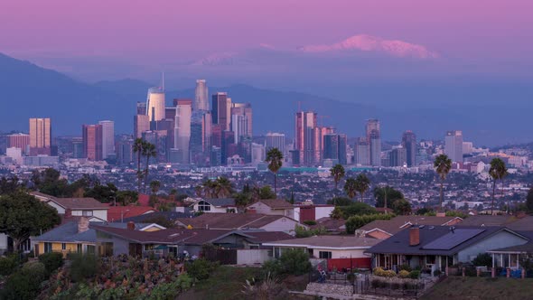 Downtown Los Angeles Skyline and Snowy Mount Baldy Mountain Sunset alt