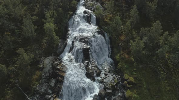 Waterfall, Rocks and Green Trees in Norway. Aerial View alt