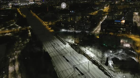 Aerial Shot of a Train Driving in the Downtown of Helsinki Finland