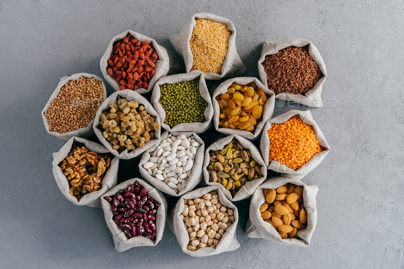 Raw healthy grain food and legume. Hessian bags of cereals and dried ...