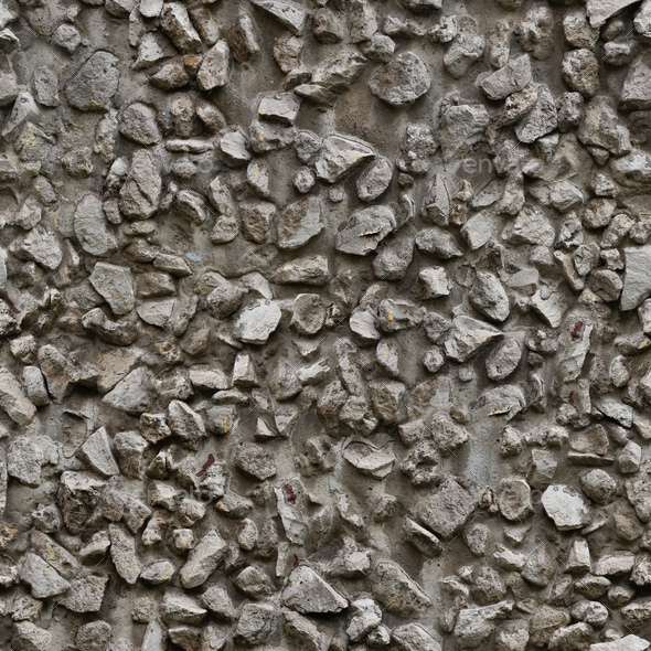 Concrete wall with stone inclusions - Stock Photo - Images