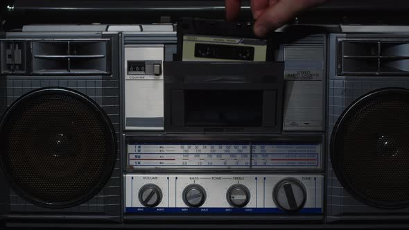 Male Hand Turning an Antiquarian Record Player on alt
