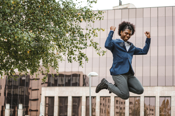 young colombian businessman jumping with excitement cause his first job