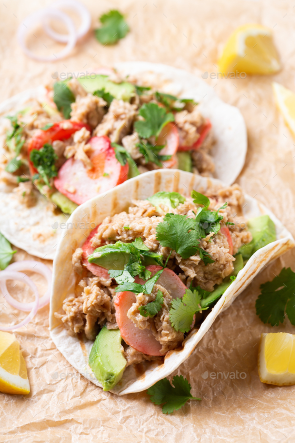Tacos with Plant based canned tuna and vegan crab Stock Photo by
