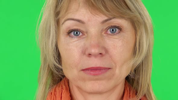 Middle Aged Blonde Woman Is Looking in Surprise at the Camera alt