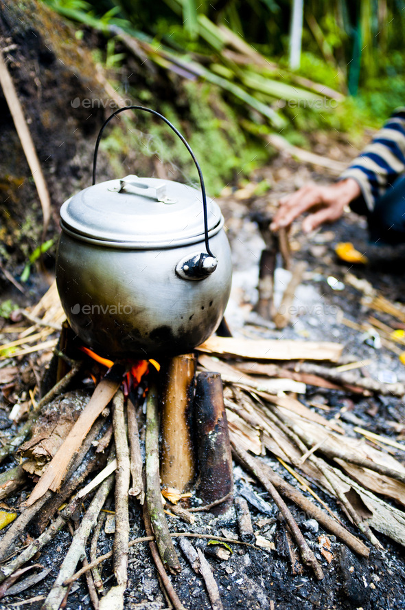 Tea Pot Boiling over the Camp Fire on the First Day of the Three Day Trek up Mount Rinjani, Lombok,