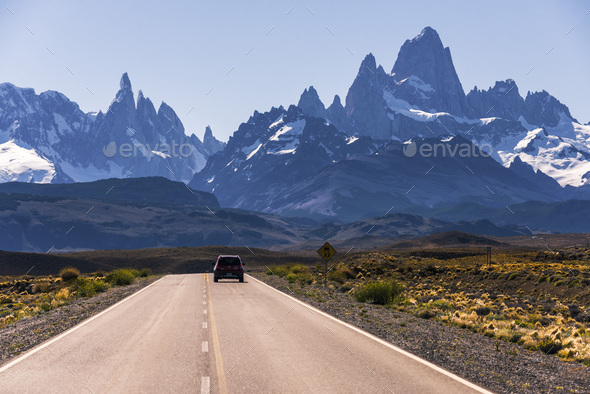 Long straight road to El Chalten, with Mount Fitz Roy (aka Cerro Chalten) behind, El Chalten, Patago - Stock Photo - Images