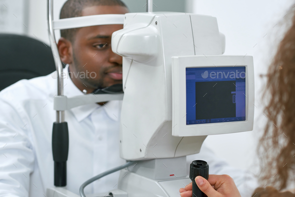 Patient looking at apparatus during vision checking